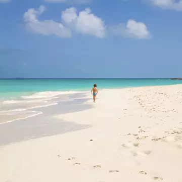 Child running in Tropic of Cancer Beach - Bahamas
