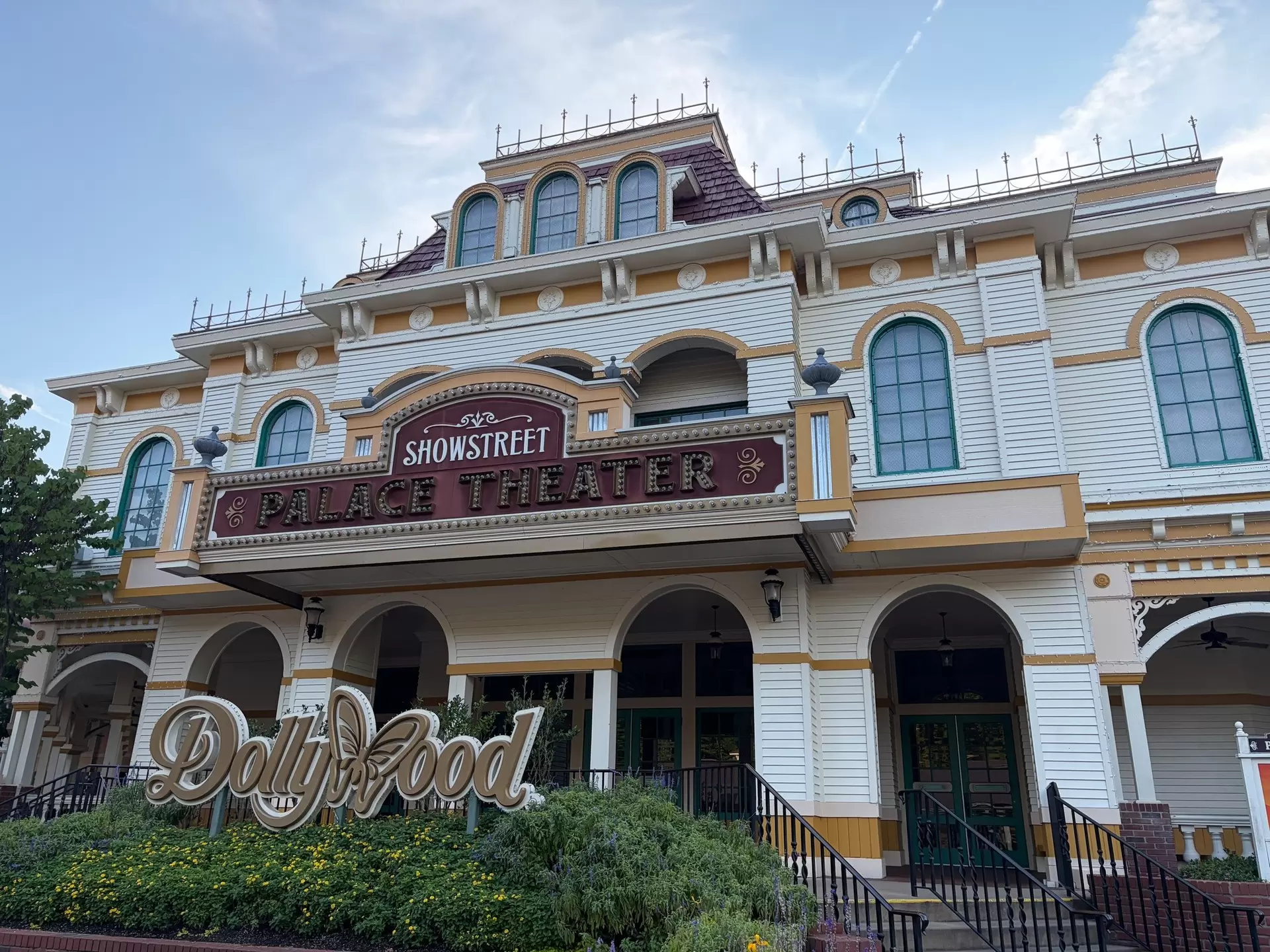 Exterior view of the Palace Theater with landscaping out front at Dollywood