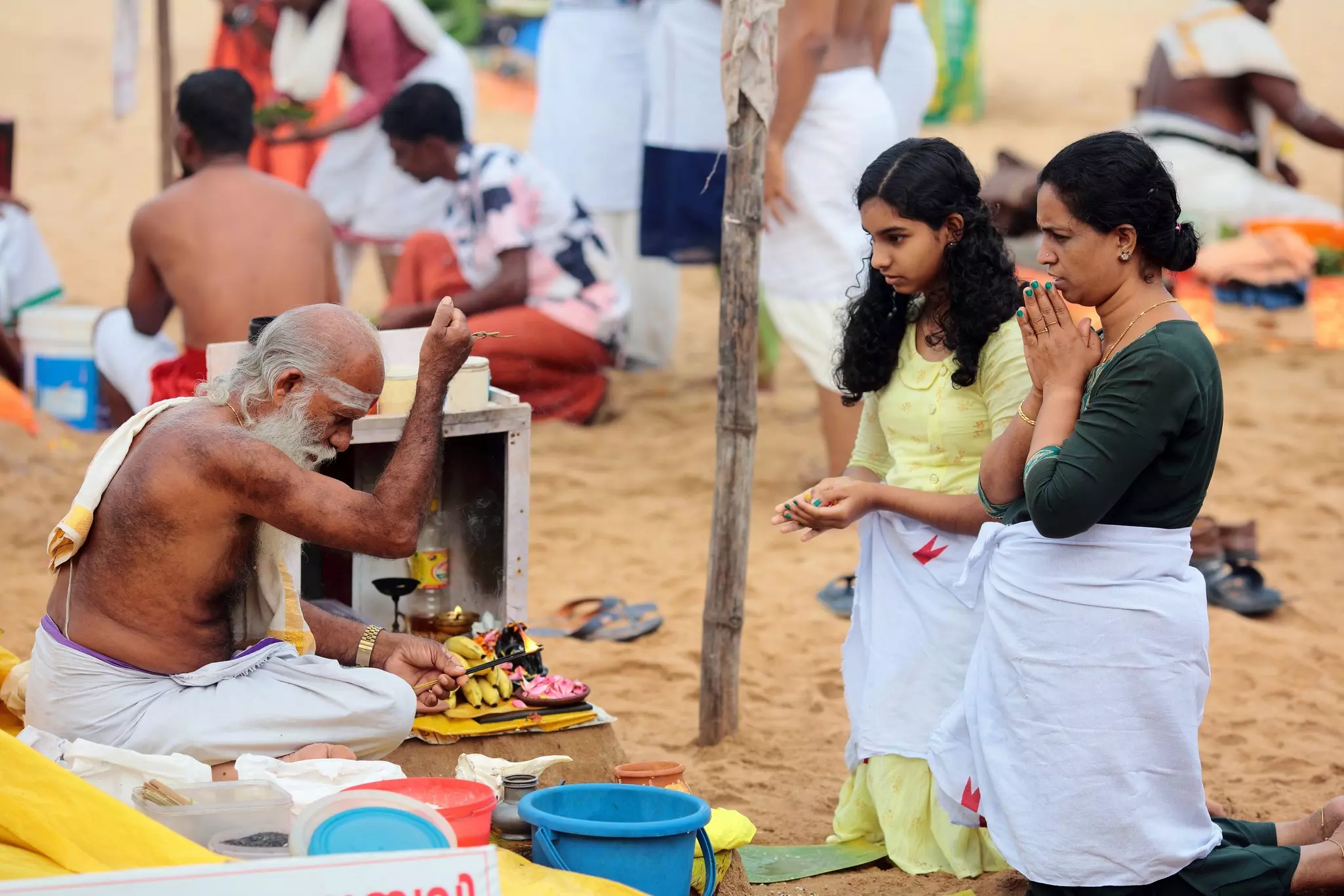 Pilgrims perform puja rituals on the beach at Varkala, Kerala, India.