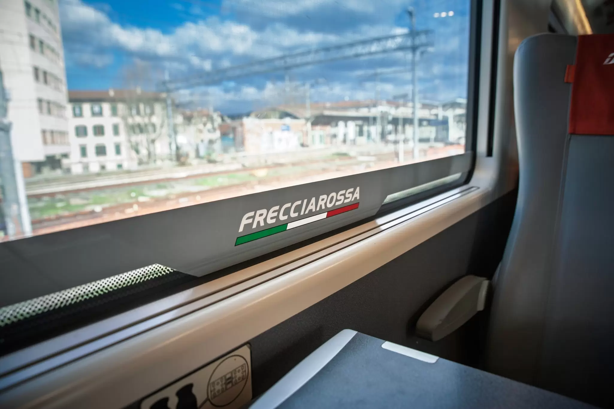 The interior of a Frecciarossa train passing through the outskirts of Rome, Italy. 