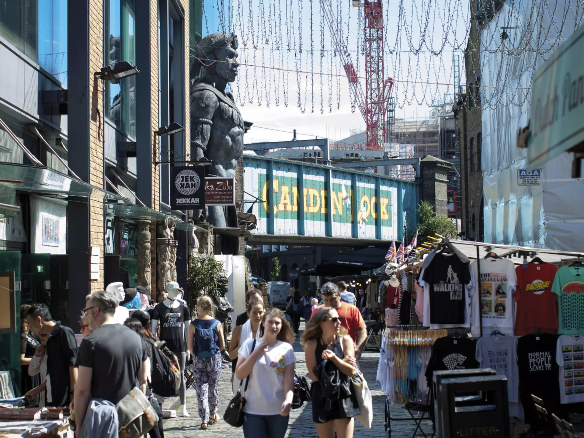People shopping at Camden Market, with Camden Lock behind.