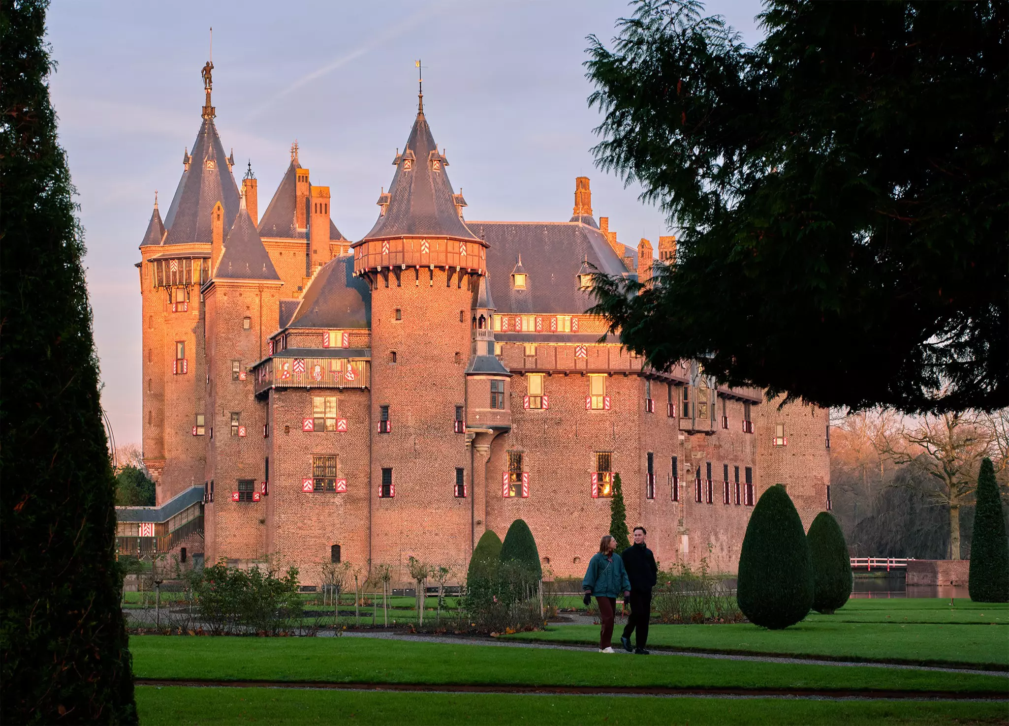 A redbrick castle at sunset.