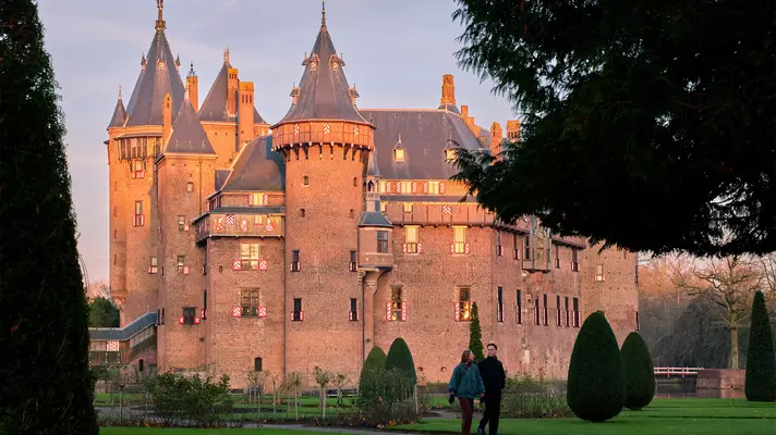 A redbrick castle at sunset.