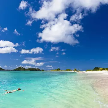 Woman floating on the turquoise waters of Martinique. ©Flavio Vallenari/Getty Images