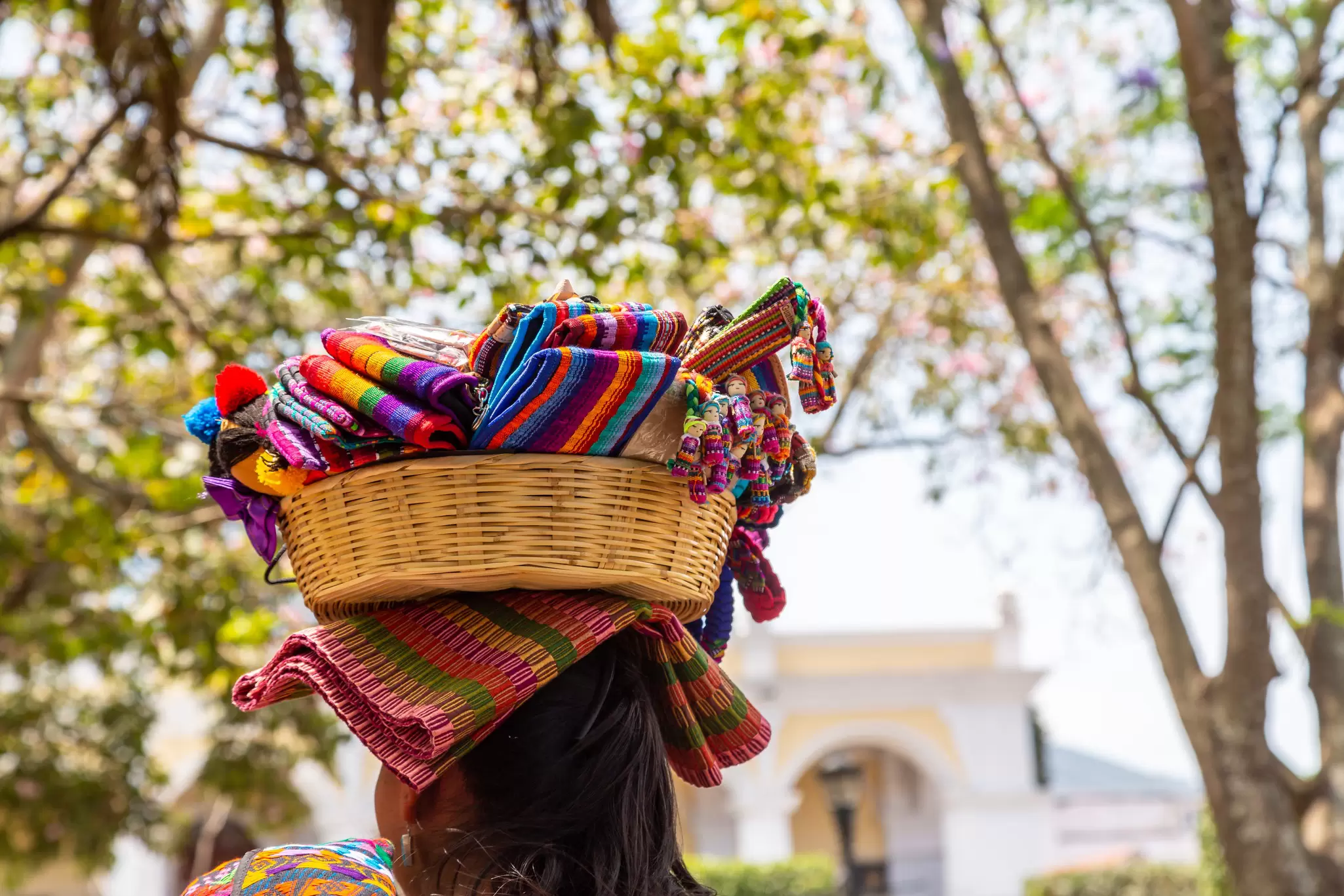 Woman with a basket of soevenirs on her head in the city of Antigua in Guatemala, Central America, License Type: media, Download Time: 2025-10-28T15:52:42.000Z, User: katelyn.perry_lonelyplanet, Editorial: false, purchase_order: 65050 - Digital Destinations and Articles, job: wip, client: wip, other: Katelyn Perry
