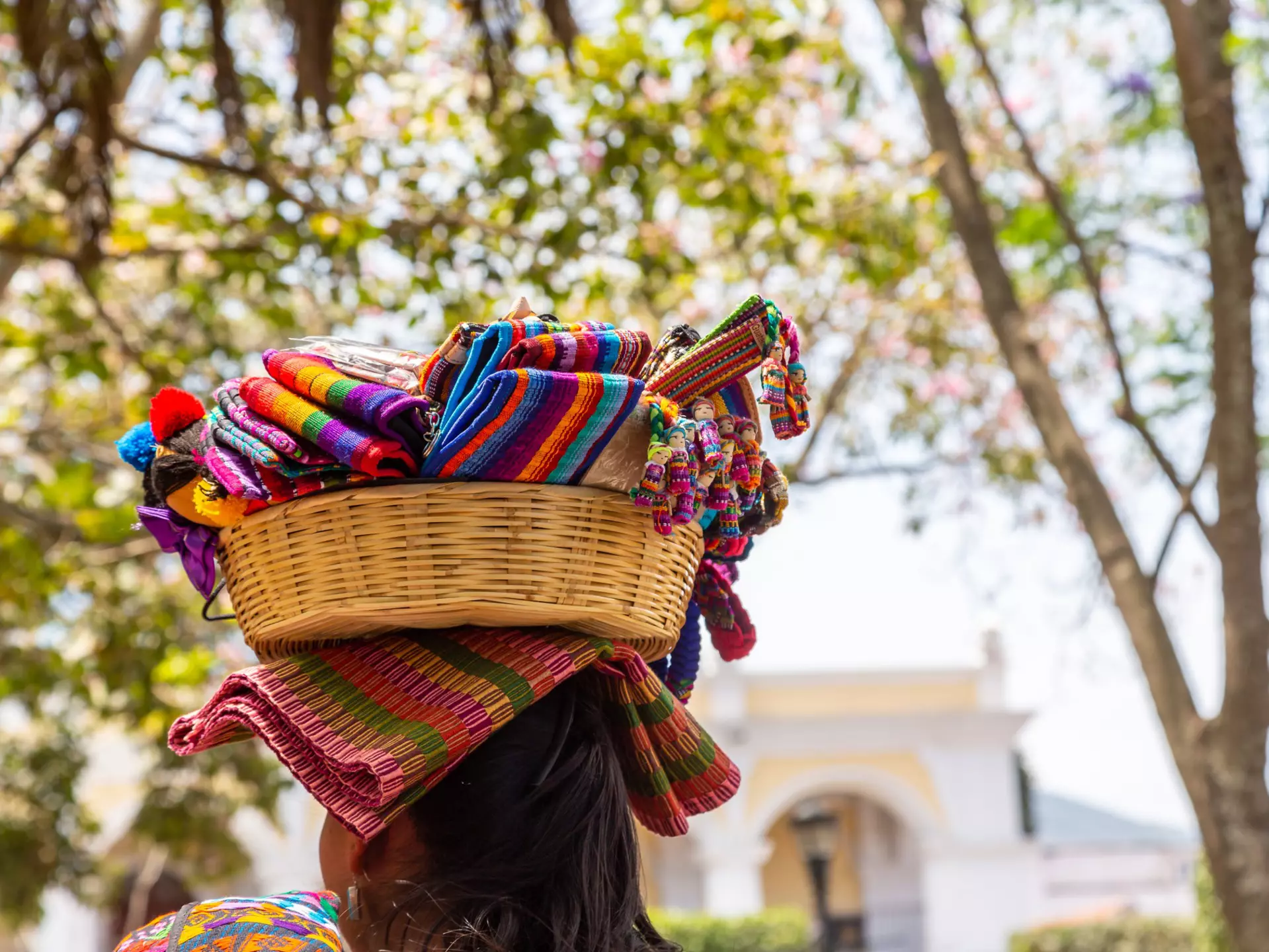 Woman with a basket of soevenirs on her head in the city of Antigua in Guatemala, Central America, License Type: media, Download Time: 2025-10-28T15:52:42.000Z, User: katelyn.perry_lonelyplanet, Editorial: false, purchase_order: 65050 - Digital Destinations and Articles, job: wip, client: wip, other: Katelyn Perry