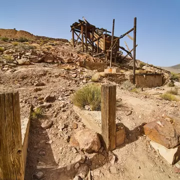 Entrance to Eureka Mine and its abandoned equipment in Death Valley National Park, California.