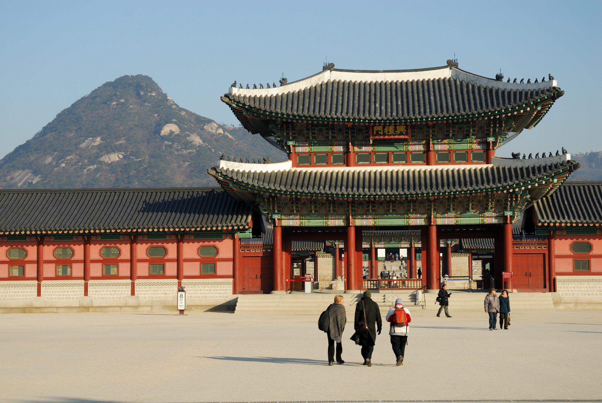 Gyeongbokgung Palace with Bugaksan in background, Gwanghwamun.
23006-2
Asia, North-East Asia, Seoul, South Korea, architecture, asian, background people, building, cropped, culture, day, differential focus, exterior, facade, front view, group of people, large group of objects, large group of people, lifestyle, luxury, majestic, mixed age range, mixed gender, mountain, outdoors, people, plenty, religion, roof, shadow, sky, technique, tourism, traditional, travel, wood, worship