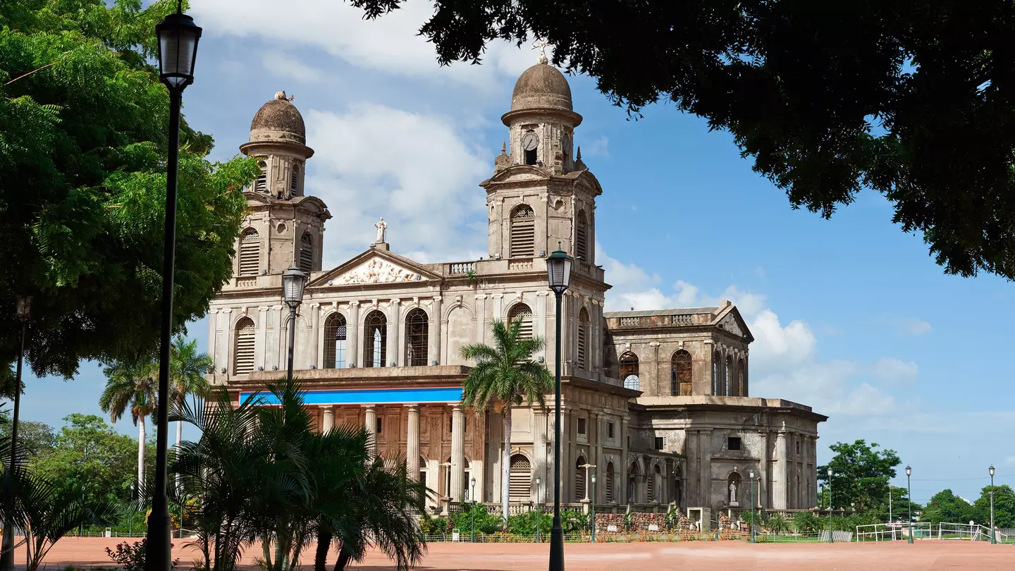 A cathedral with two domed bell towers.