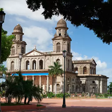 A cathedral with two domed bell towers.