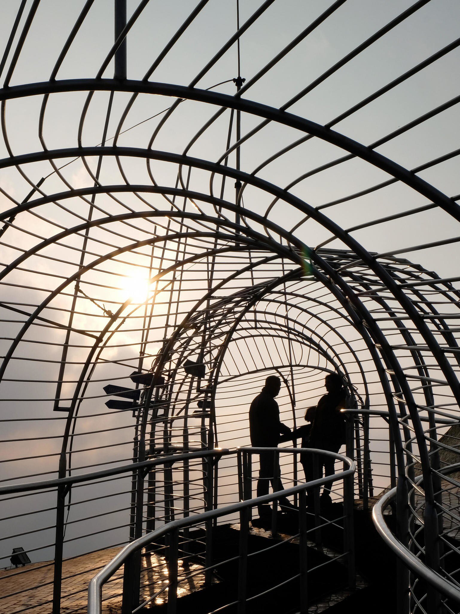 Silhouettes at the fenced observation roof at the Don Bosco Museum in Shillong, Meghalaya State, Northeast India.