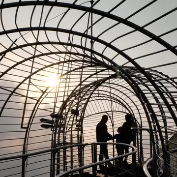 Silhouettes at the fenced observation roof at the Don Bosco Museum in Shillong, Meghalaya State, Northeast India.