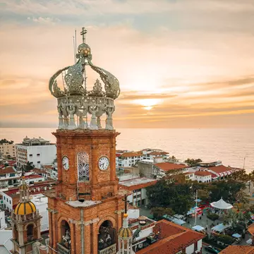 Aerial view of The Church of Our Lady of Guadalupe in Puerto Vallarta, Mexico, during sunset.