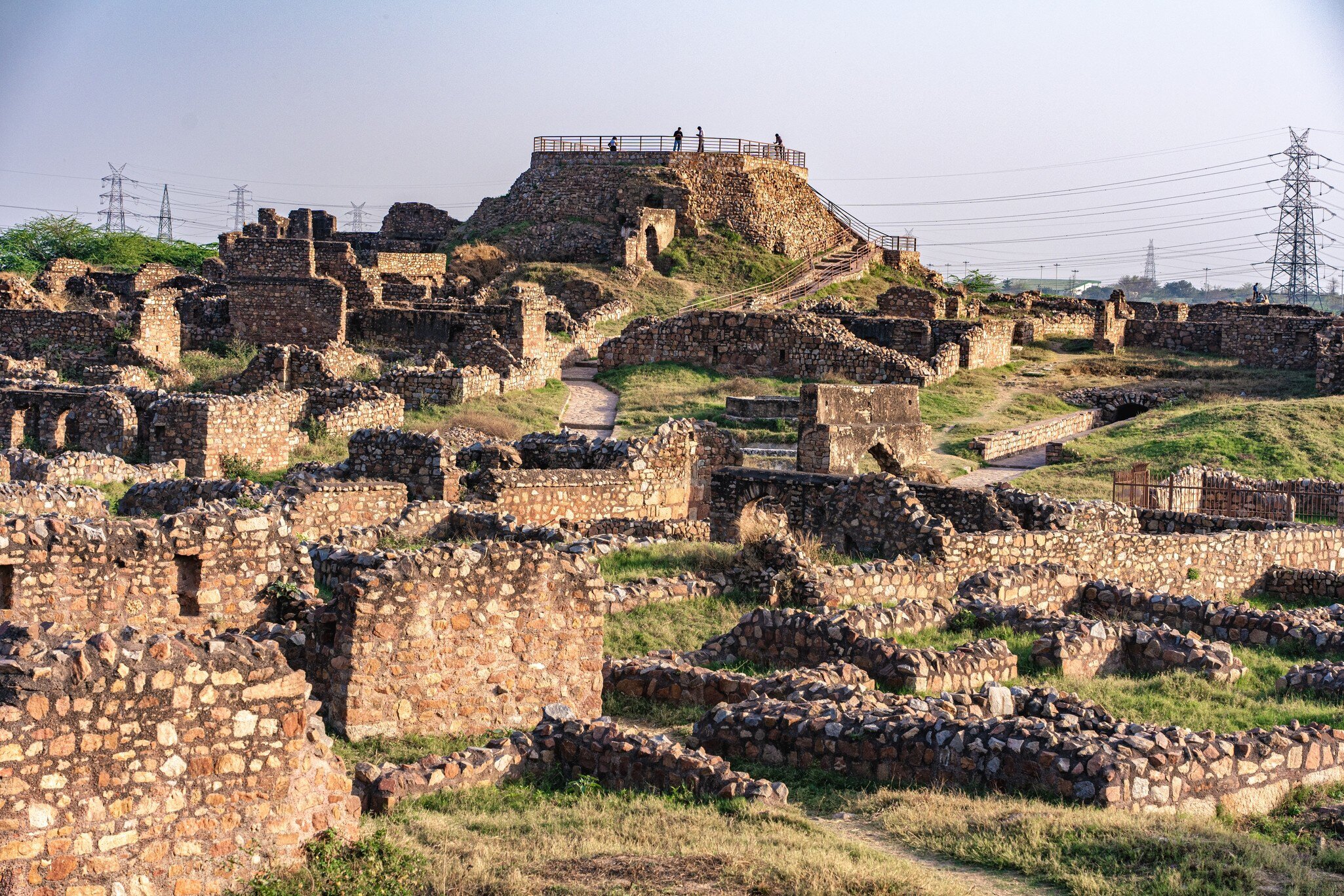 Tughlaqabad Fort in Delhi, a 14th-century medieval fortress built by Ghiyas-ud-din Tughlaq. Showcases massive stone walls, ancient ruins, and the architectural legacy of the Delhi Sultanate.