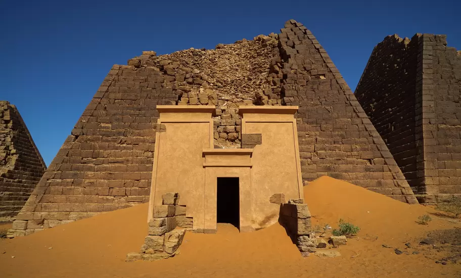 500px Photo ID: 105906647 - More than 200km from the Sudanese capital Khartoum, the remains of an ancient city rise from the arid and inhospitable terrain like a science-fiction film set. Nestled between sand dunes, the secluded pyramids seem to have been
