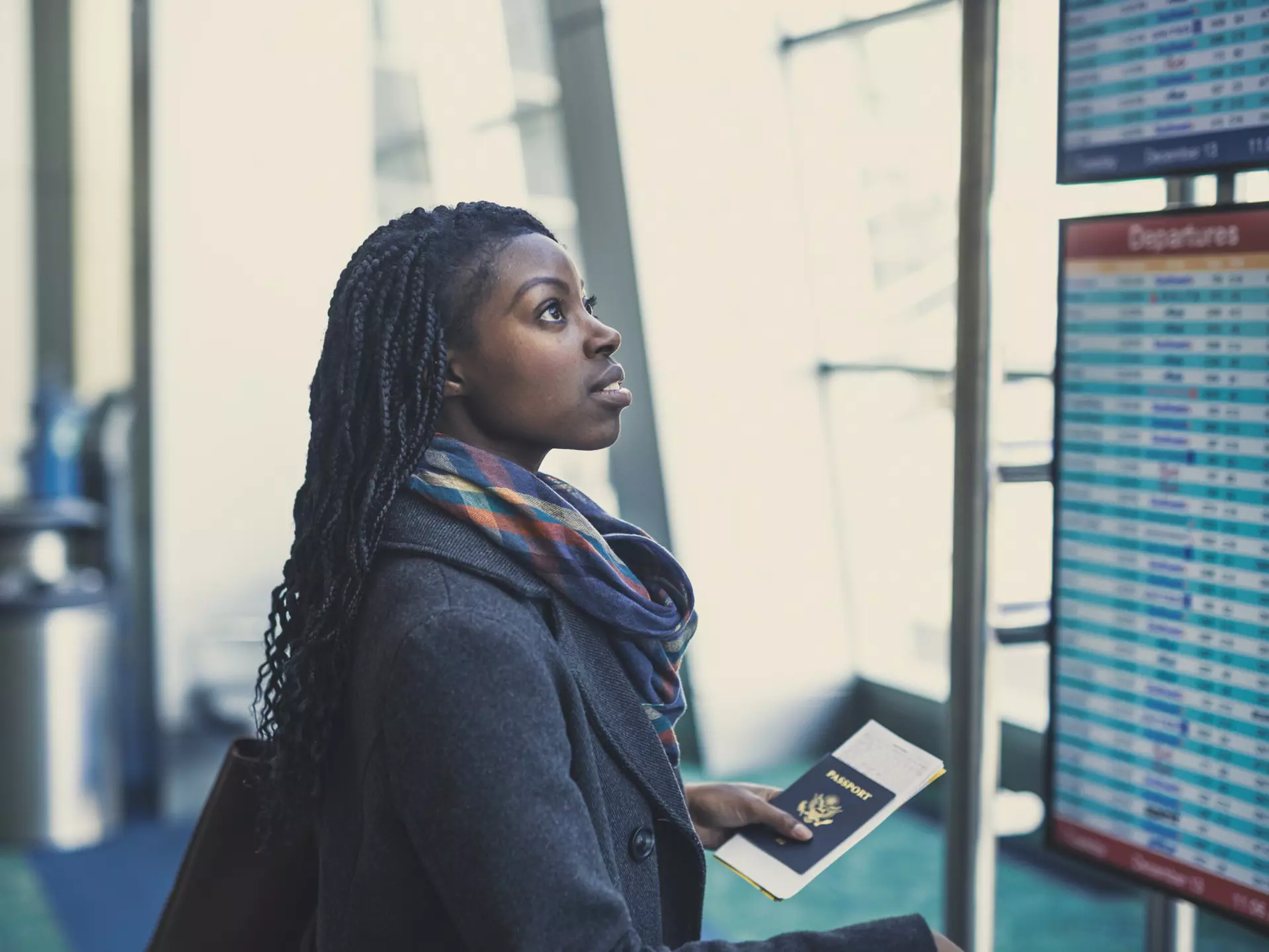 Young woman at an airport holding passport and looking at the departures board.
844219924
Mixed Race Person, One Young Woman Only, Travel Destinations, Horizontal, Only Women, Fashionable, Photography, Elegance, Waiting, Adults Only, Passport, Latin American and Hispanic Ethnicity, Business, Casual Clothing, Modern, Businesswoman, Business Finance and Industry, African-American Ethnicity, Purse, People, 20-29 Years, Leaving, Tourist, Luggage, Adult, Confidence, Airport, Fashion, Positive Emotion, One Woman Only, Young Adult, Beautiful Woman, Journey, Smiling, Suitcase, Architecture, Hair, African American, Flying, Indoors, Arts Culture and Entertainment, USA, Lifestyles, Travel, Vacations, Cheerful, Concepts, One Person, Station, Young at Heart, Success, Transportation, Happiness, Women, Business Person