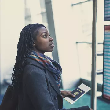 Young woman at an airport holding passport and looking at the departures board.
844219924
Mixed Race Person, One Young Woman Only, Travel Destinations, Horizontal, Only Women, Fashionable, Photography, Elegance, Waiting, Adults Only, Passport, Latin American and Hispanic Ethnicity, Business, Casual Clothing, Modern, Businesswoman, Business Finance and Industry, African-American Ethnicity, Purse, People, 20-29 Years, Leaving, Tourist, Luggage, Adult, Confidence, Airport, Fashion, Positive Emotion, One Woman Only, Young Adult, Beautiful Woman, Journey, Smiling, Suitcase, Architecture, Hair, African American, Flying, Indoors, Arts Culture and Entertainment, USA, Lifestyles, Travel, Vacations, Cheerful, Concepts, One Person, Station, Young at Heart, Success, Transportation, Happiness, Women, Business Person