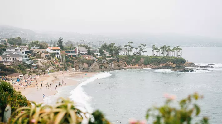 A crescent-shaped bay on a cloudy day