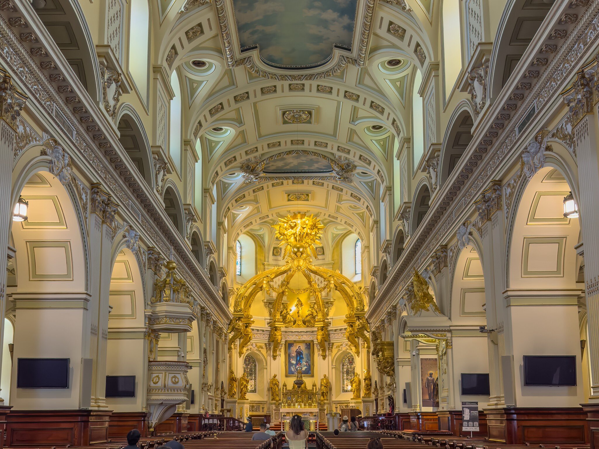 GettyImages-2291254955.jpg
Wide perspective view looking down nave toward golden altar inside Notre-Dame de Quebec Cathedral.