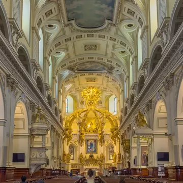 GettyImages-2291254955.jpg
Wide perspective view looking down nave toward golden altar inside Notre-Dame de Quebec Cathedral.