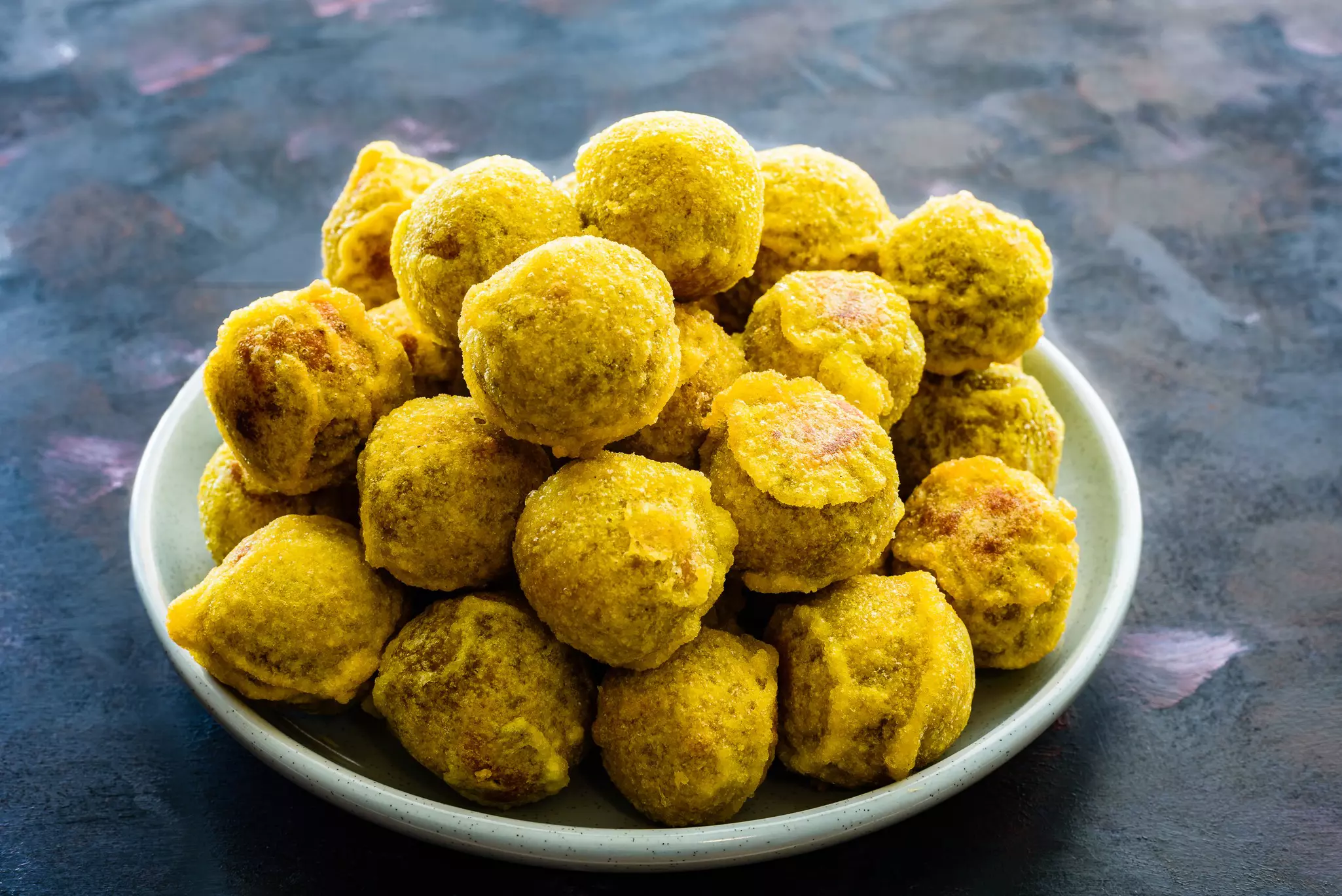 Payatham paniyaram, a sweet vegan snack. Paskaran.T/Shutterstock