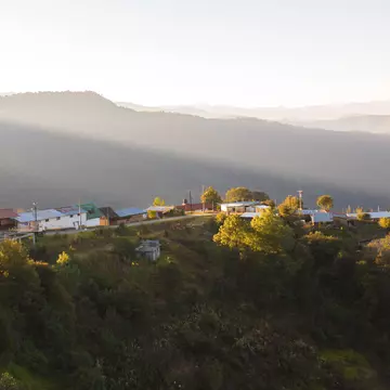 View of the sunrise over a rural mountain town in Oaxaca, Mexico.