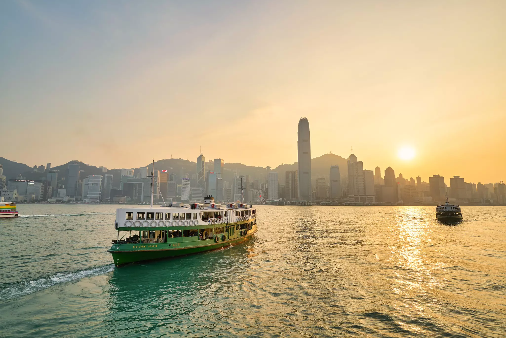 A Star Ferry crossing Victoria Harbour in the late afternoon sun.