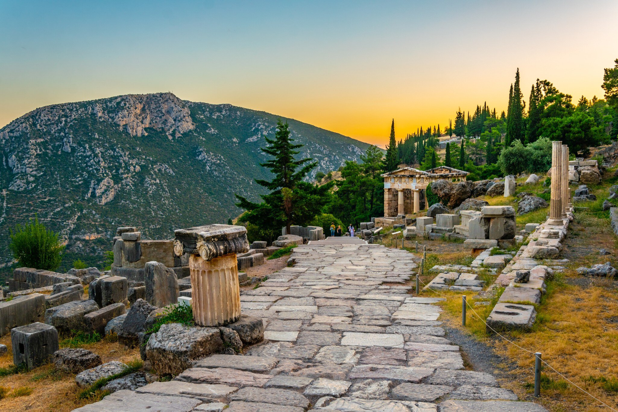 Sunset view of the Athenian treasury at Ancient Delphi in Greece.