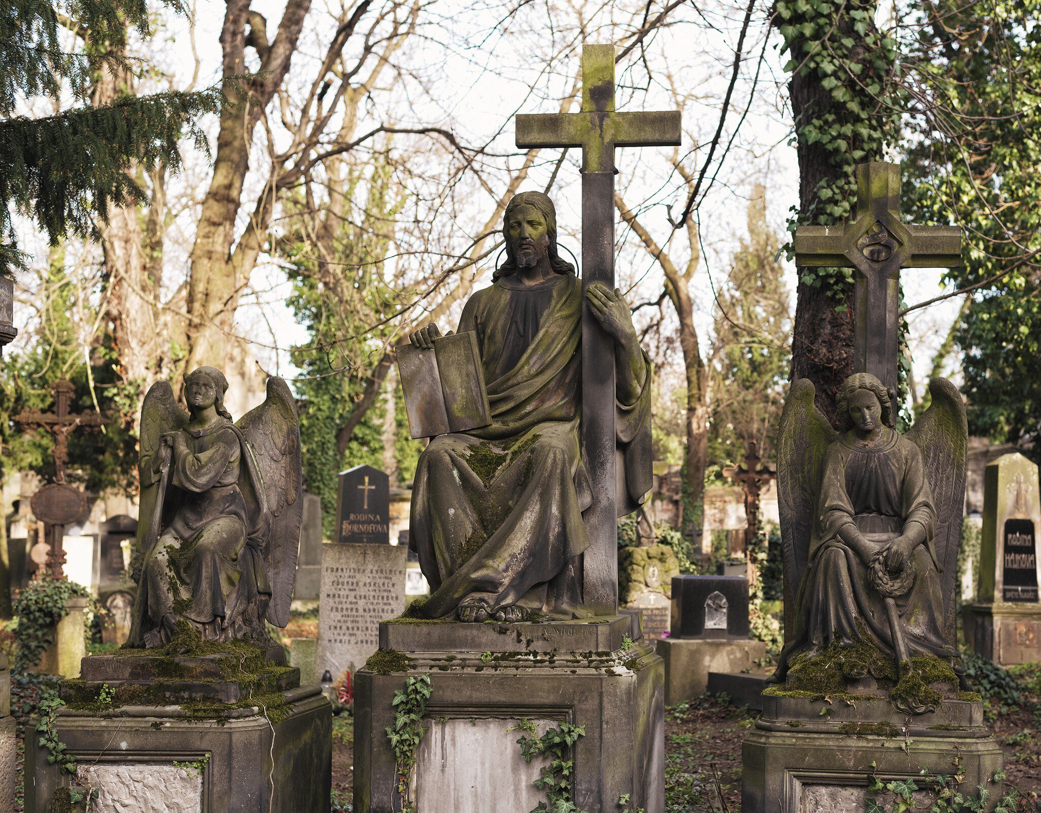 Prague, Czech Republic. Olšany cemetery, ancient catholic graves, angels and crosses.