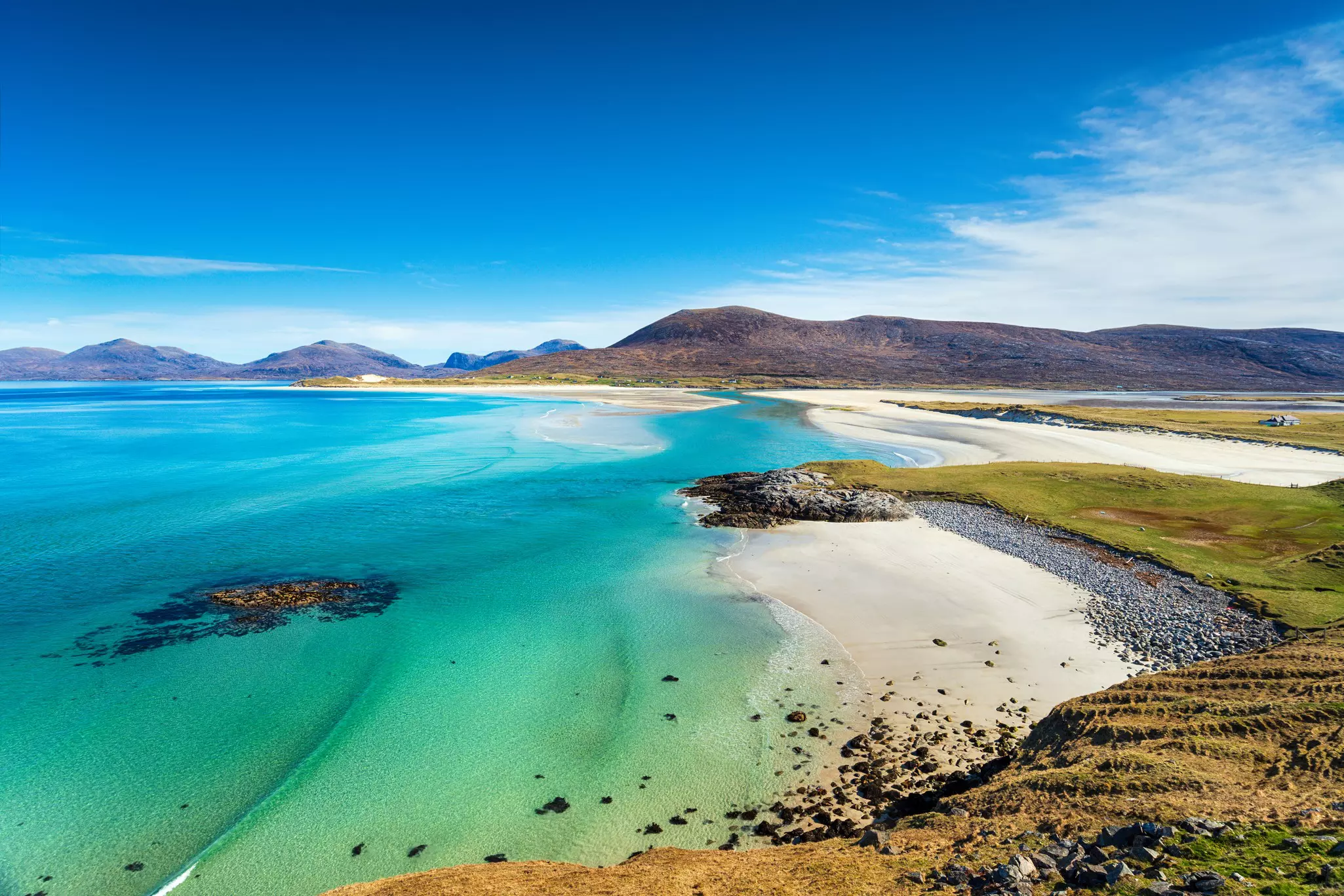 The beautiful sandy beach and clear turquoise sea at Seilebost on the isle of Harris, Outer Hebrides, Scotland.