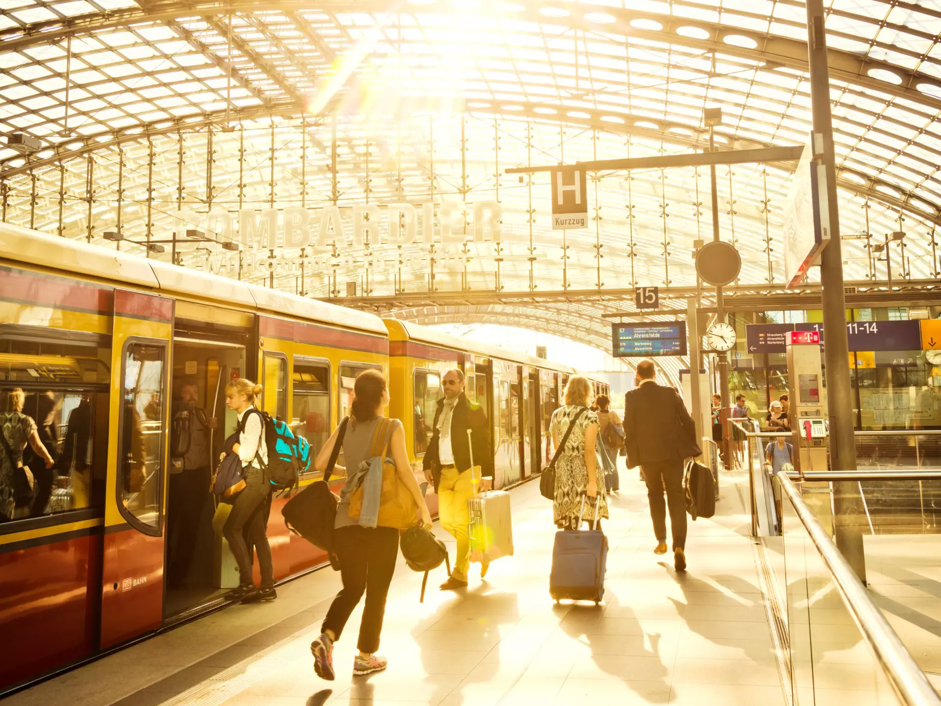 Passengers moving through modern main railway station at Berlin Hauptbahnhof as the S-Bahn train waits for passengers to board © Nikada / Getty Images