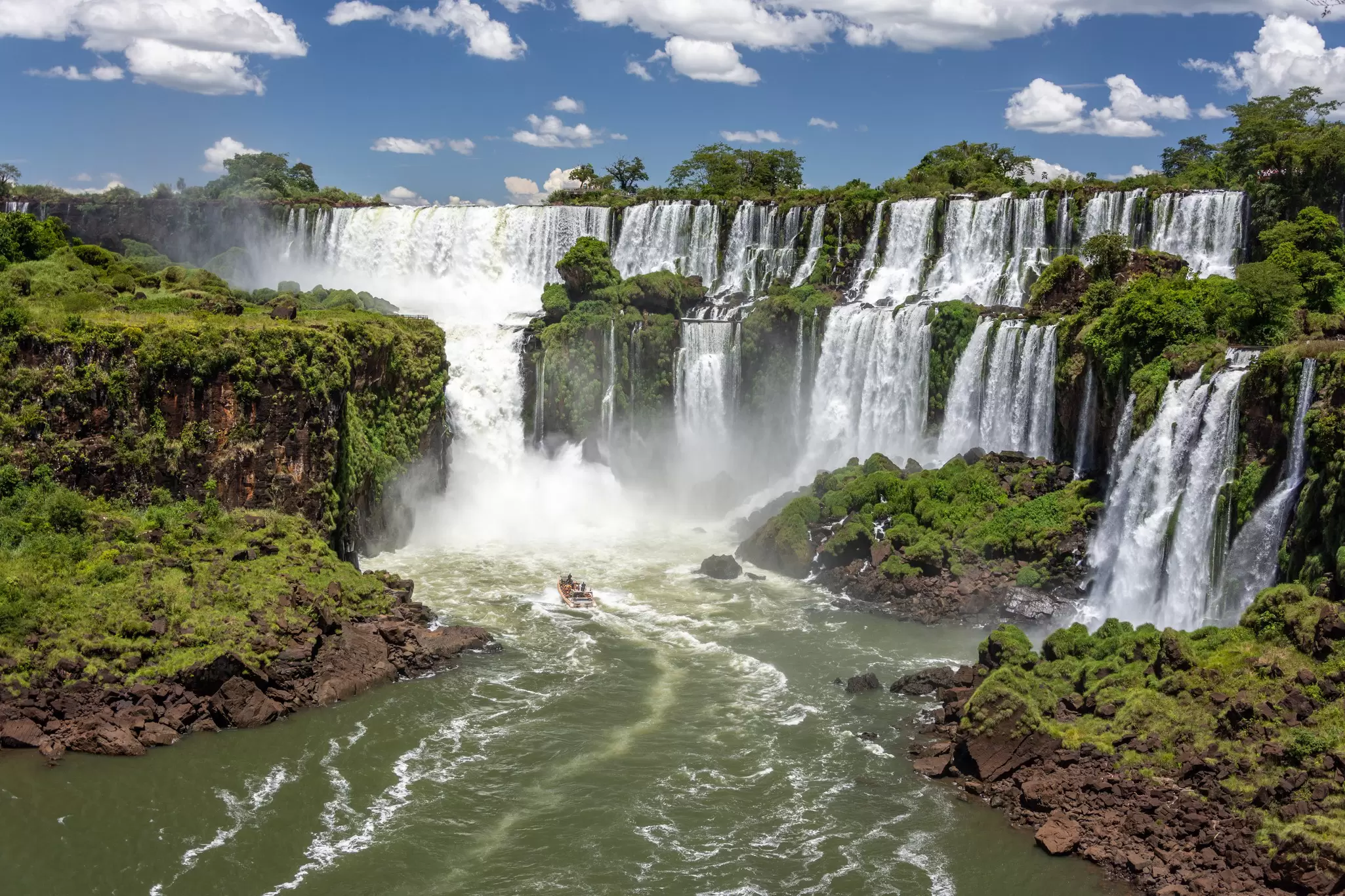 View of Iguazú Falls on a sunny day in Argentina.