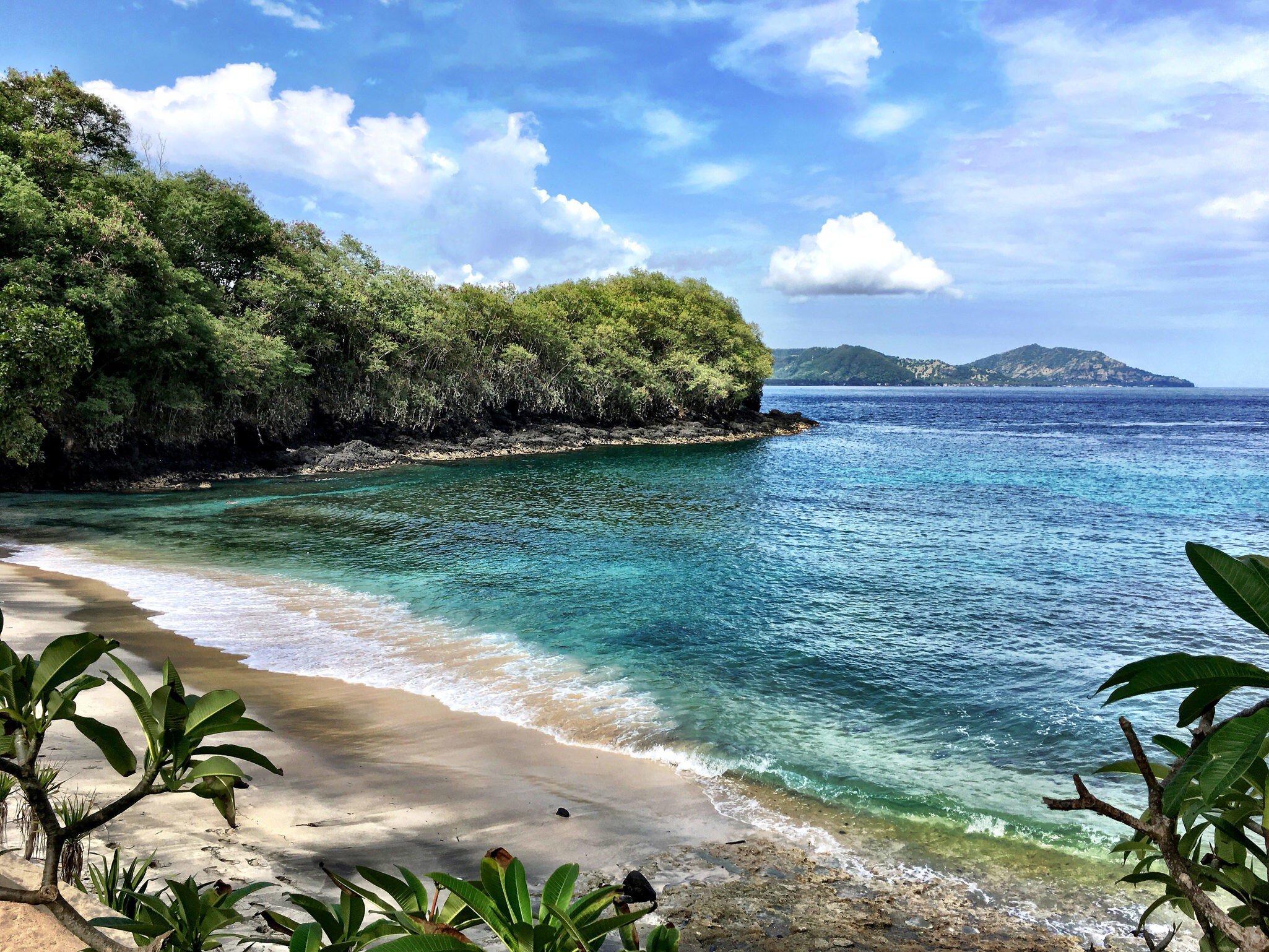 The idyllic Blue Lagoon Beach with the coral reef visible through clear water.
637676016
Padang Bay, No People, Tranquil Scene, Coastline, Padang - Bali, Coral - Cnidarian, Outdoors, Snorkeling, Cliff, Day, Bay of Water, Travel Destinations, Horizontal, Island, Indonesia, Lagoon, Idyllic, Photography, Tranquility, Sea, Cloud - Sky, Transparent, Bali, Hiding, Blue, Vacations, Color Image, Beach