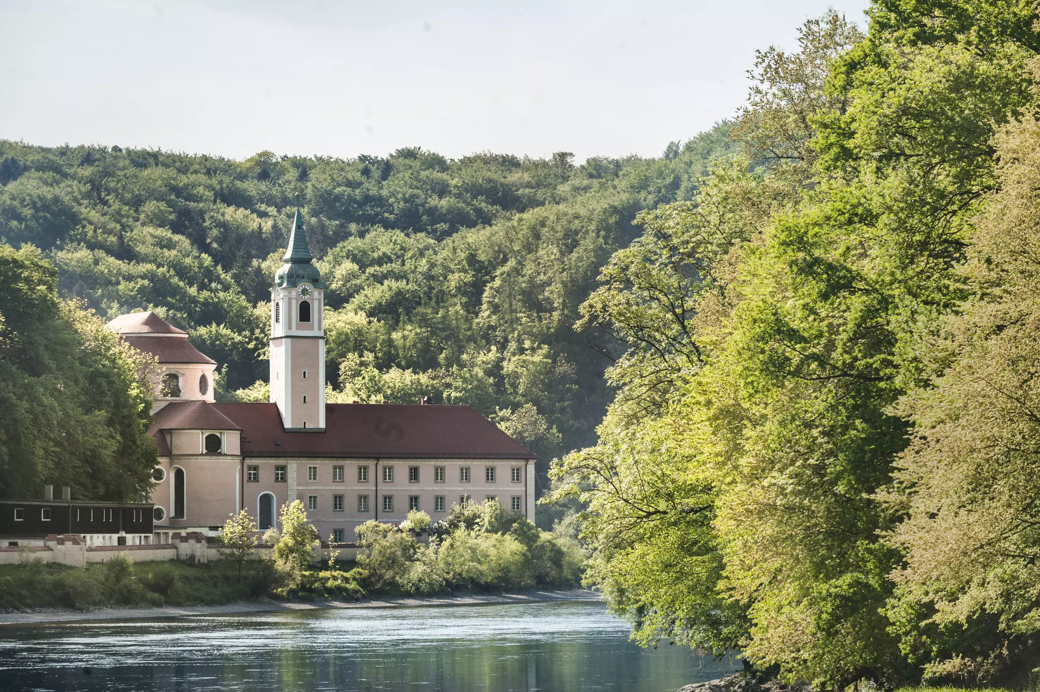 The Weltenburg monastery sits in a beautiful wooded hollow on the banks of the Danube River in Bavaria, Germany