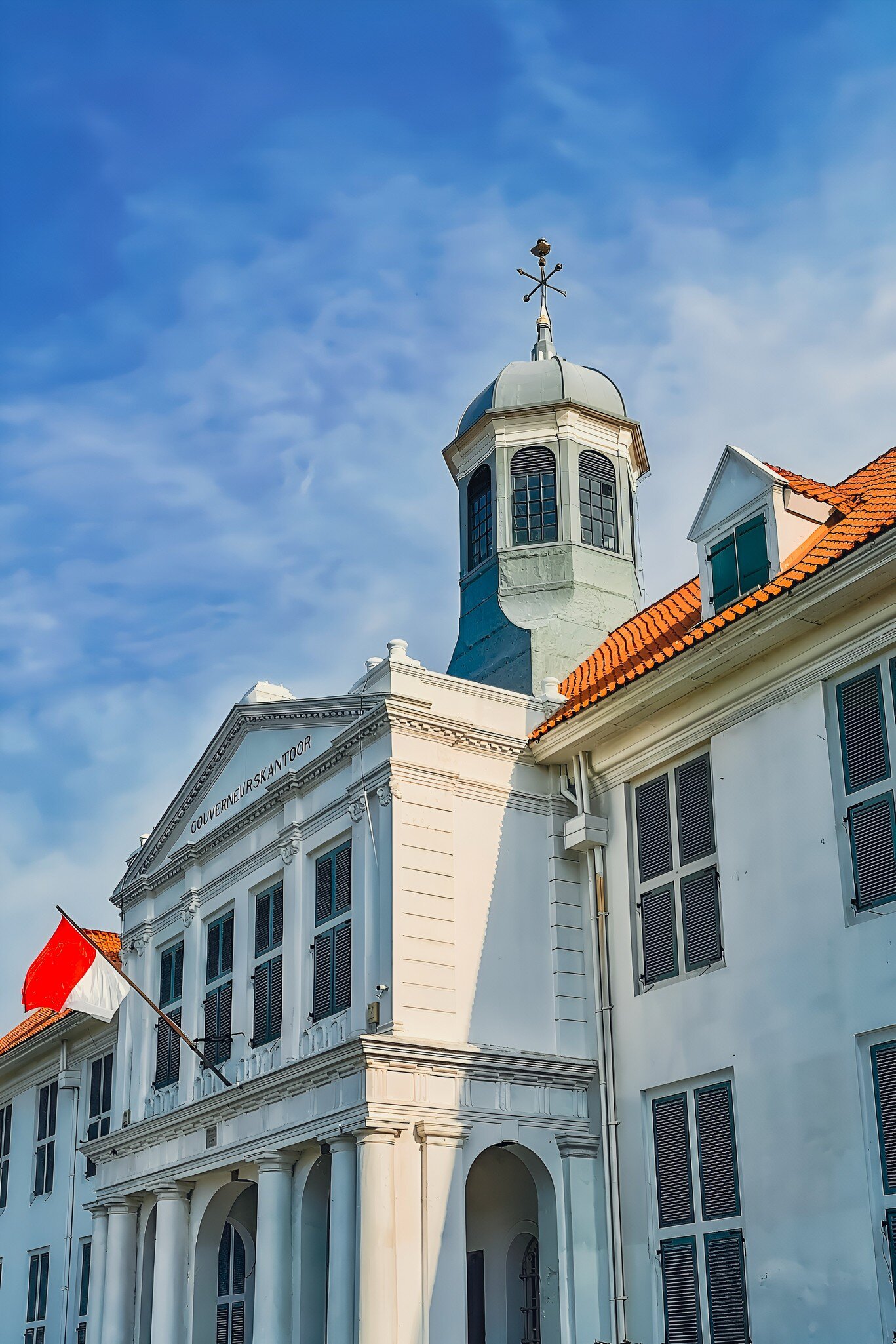Indonesian red white flag flies gracefully on the building of The Jakarta History Museum or Museum Sejarah Jakarta or Fatahillah Museum or Batavia Museum, in the Jakarta Old Town, Kota Tua area. , License Type: media, Download Time: 2025-05-28T10:02:18.000Z, User: lonelyplanetmedia, Editorial: false, purchase_order: 65050 - Digital Destinations and Articles, job: Global Publishing WIP, client: Global Publishing WIP, other: Peterson Haggarty // SS Comp Ingestion