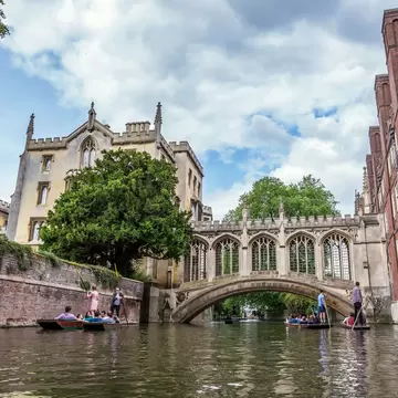 Tourists under Bridge of Sighs at Saint John's College. Named for a famous Venice landmark, this circa-1831 covered arch bridge connects campus buildings, Cambridge, England, 21st of May 2017; Shutterstock ID 763444831; your: Bridget Brown; gl: 65...