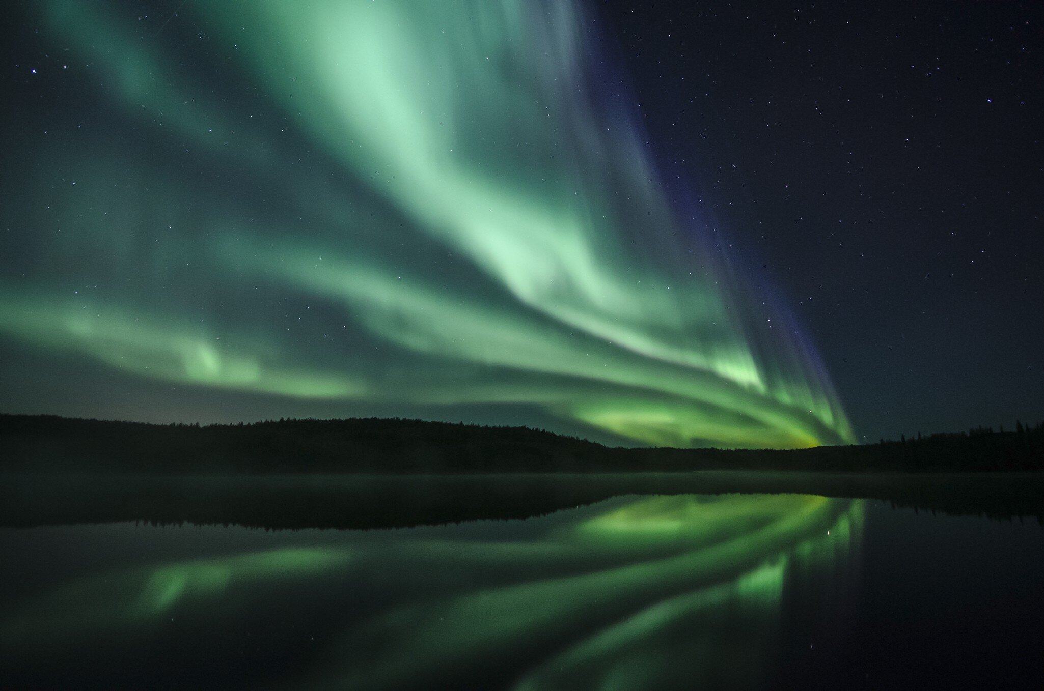 Aurora Borealis reflecting in lake, Yellowknife, Northwest Territories, Canada