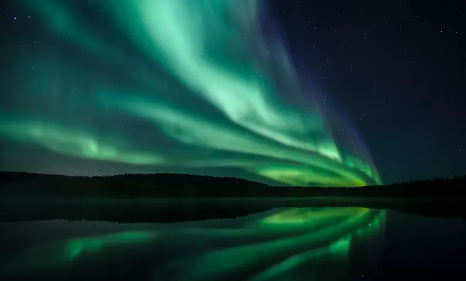 Aurora Borealis reflecting in lake, Yellowknife, Northwest Territories, Canada
