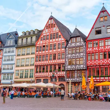 Frankfurt, Germany - June 10, 2025: Vibrant architecture of half-timbered houses in Römerberg Square, bustling with people enjoying outdoor cafes against a bright sky., License Type: media, Download Time: 2025-10-02T07:47:39.000Z, User: claramonitto, Editorial: true, purchase_order: 56530 - Guidebooks, job: Global Publishing-WIP, client: Germany 12, other: Clara Monitto