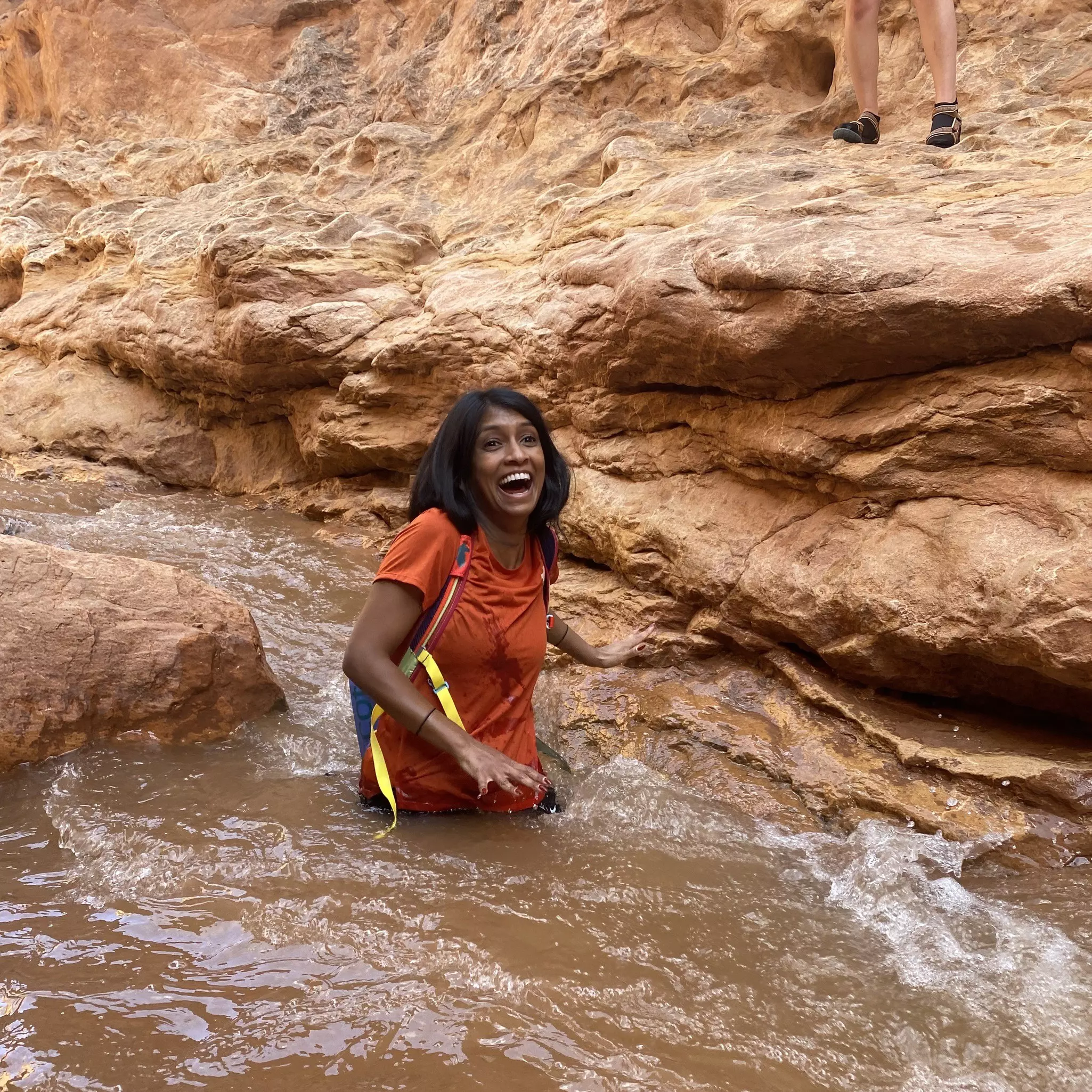 Wading through waterfalls on Capitol Reef National Park’s Sulfur Creek Trail © Deepa Lakshmin / Lonely Planet