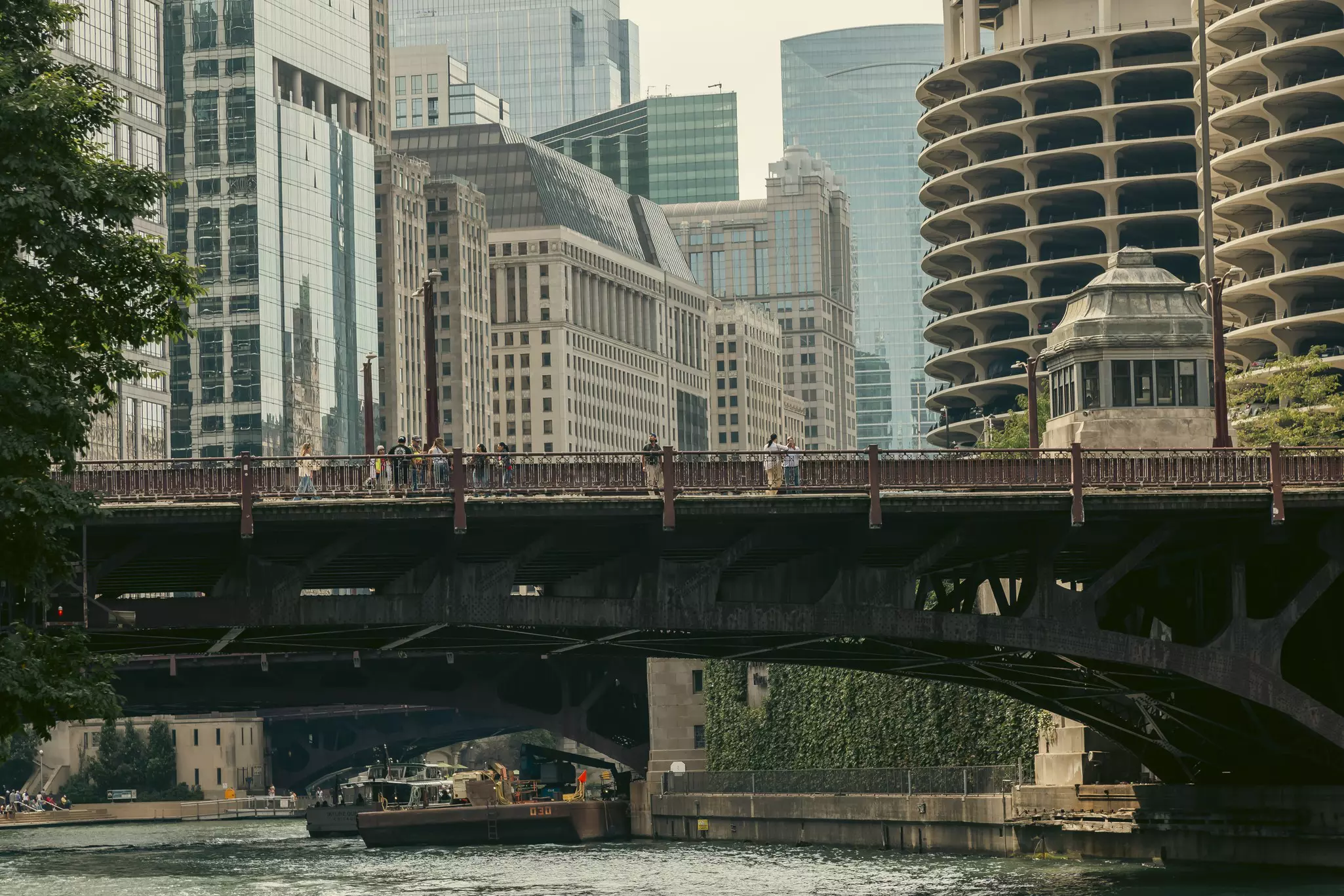 A bridge over a river with skyscrapers on all sides.