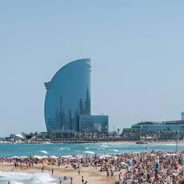 People enjoying a sunny day on a crowded beach