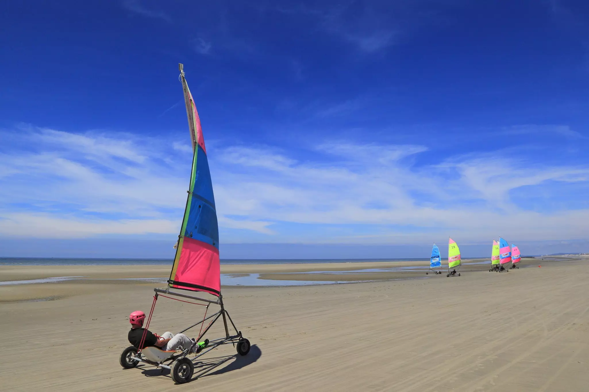 Char à voile, or sand sailing, is an essential way to take in the region’s sprawling beaches © Philippe Turpin / Getty Images