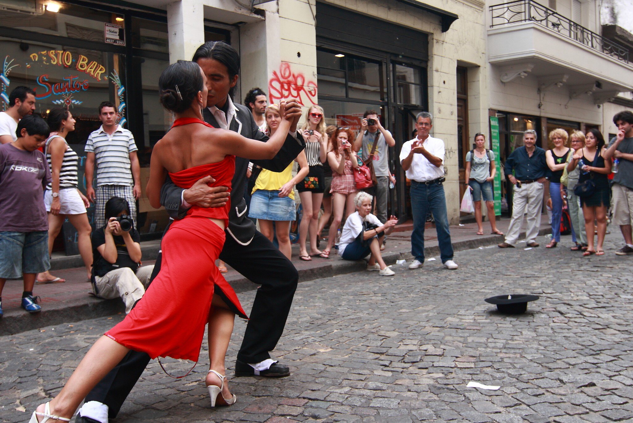 BUENOS AIRES - FEBRUARY 25: A pair of tango dancers perform on February 25, 2009 in San Telmo in Buenos Aires, Argentina. The tango dance originated from Buenos Aires and Montevideo, Uruguay.