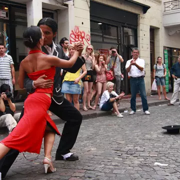 BUENOS AIRES - FEBRUARY 25: A pair of tango dancers perform on February 25, 2009 in San Telmo in Buenos Aires, Argentina. The tango dance originated from Buenos Aires and Montevideo, Uruguay.