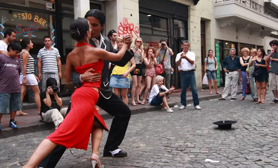 BUENOS AIRES - FEBRUARY 25: A pair of tango dancers perform on February 25, 2009 in San Telmo in Buenos Aires, Argentina. The tango dance originated from Buenos Aires and Montevideo, Uruguay.