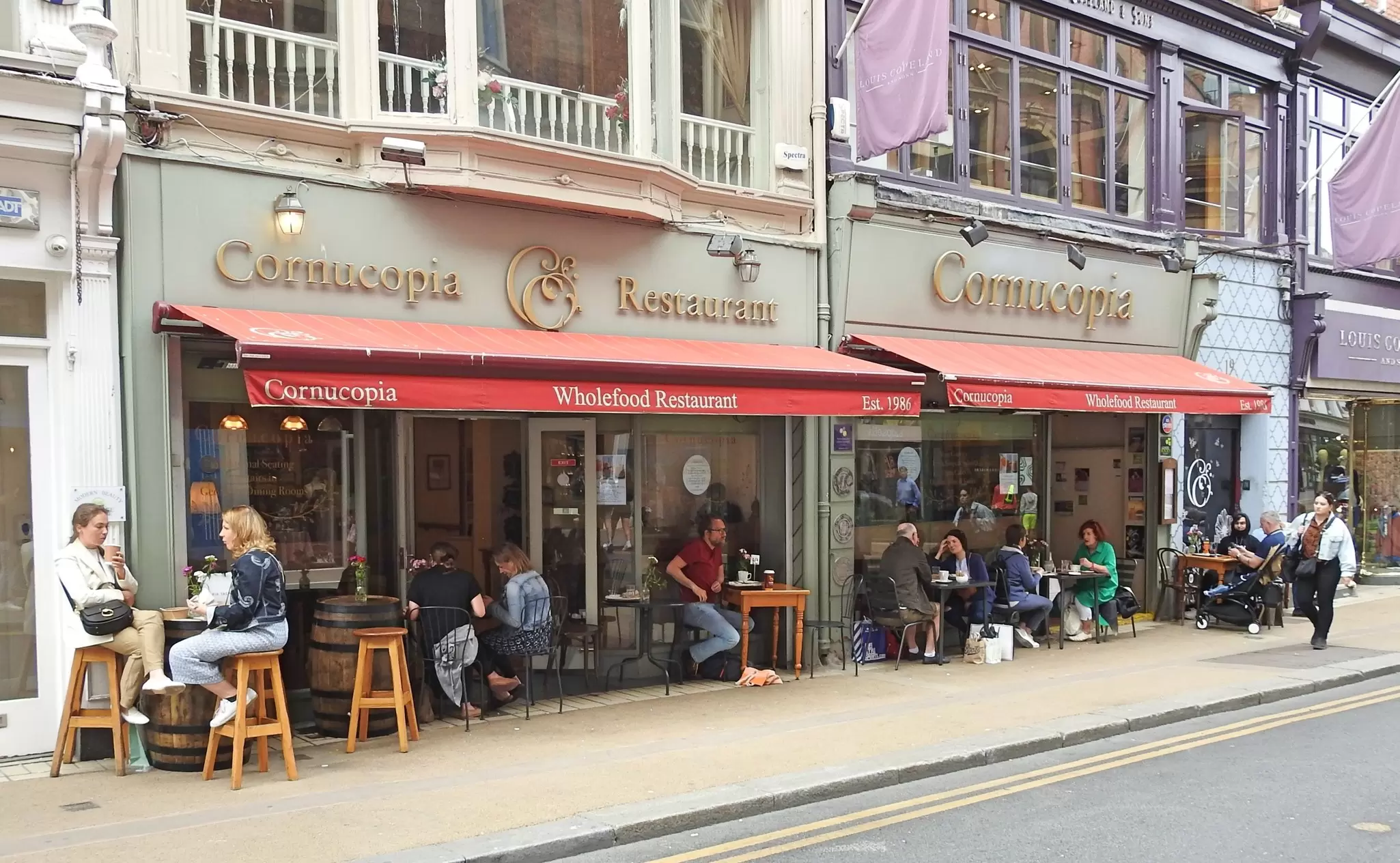 People dining at tables outside Cornucopia restaurant on Wicklow Street, Dublin. 