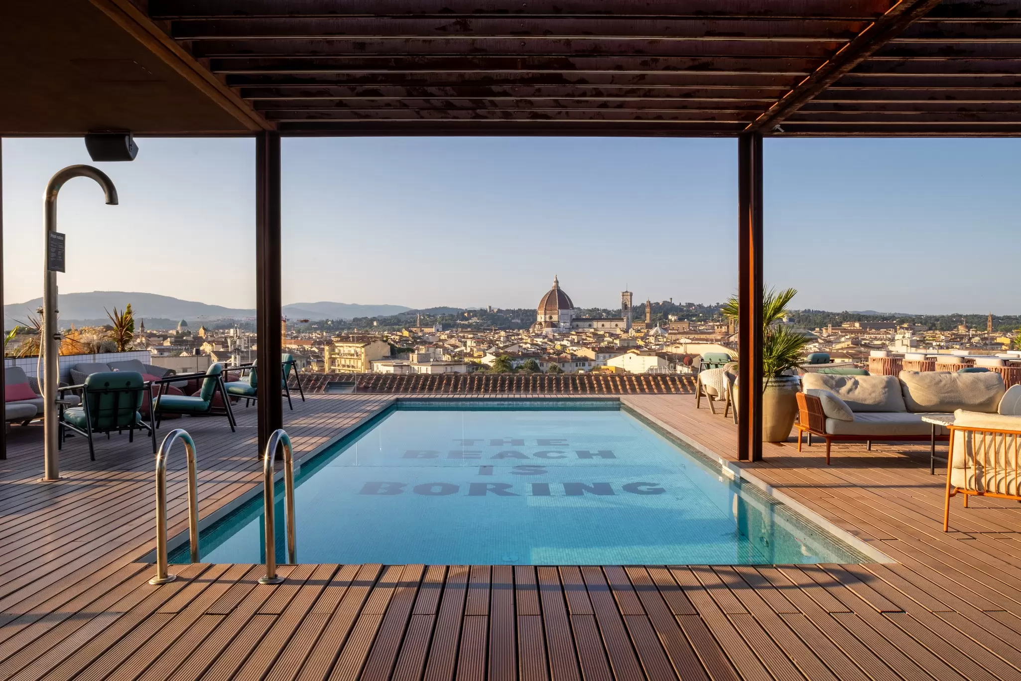 A rooftop pool overlooking the Florence skyline