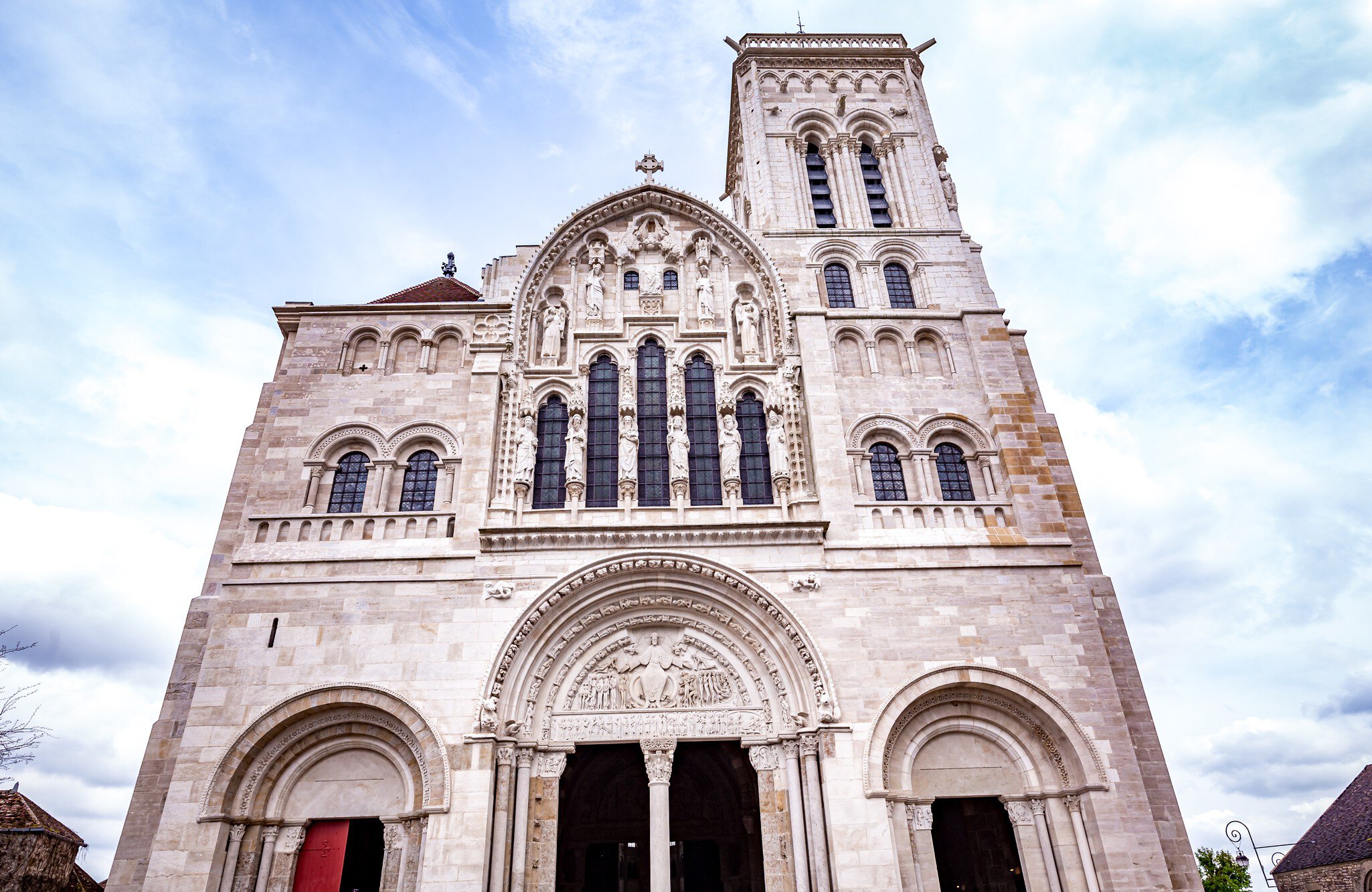 Vezelay, france, april 13, 2022 : exteriors and architectural details of portal entrance of  Saint Mary Magadalene abbey