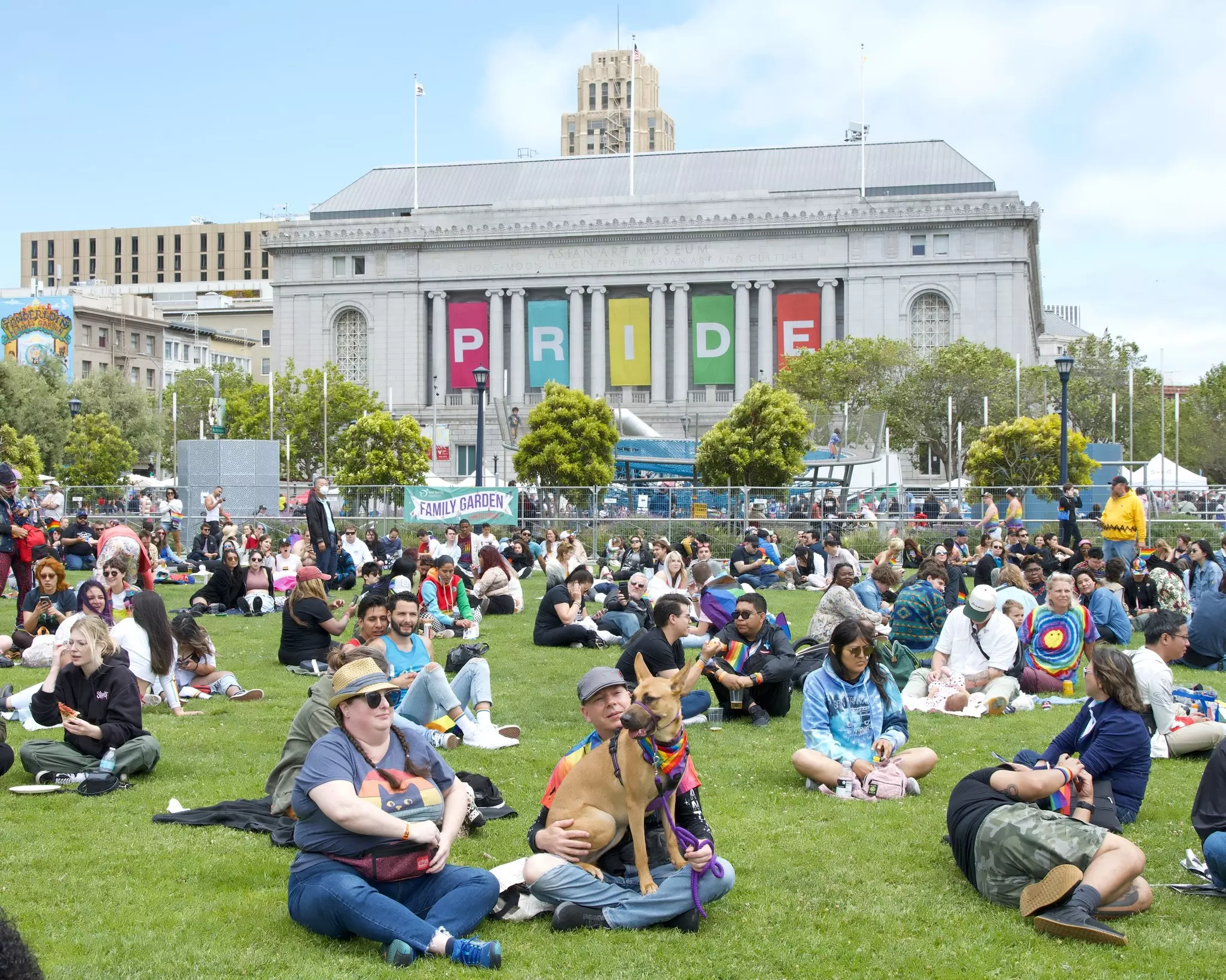 Participants relaxing on the grassy park by the Asian Art Museum for Gay Pride festival in UN Square.